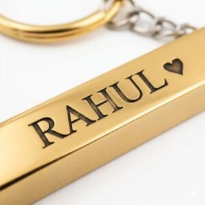 Gold personalized keychain with engraved name Rahul and heart symbol in close-up detail