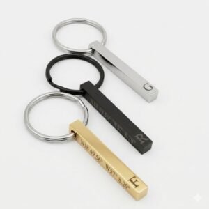 Set of three personalized bar keychains in gold, black, and silver finishes with engraving examples