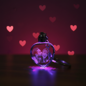 High-quality LED glowing crystal photo keychain showing clear laser engraving detail in the dark.