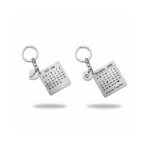 Set of two customized calendar keychains with engraved dates and couple messages