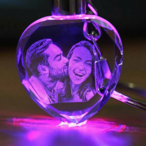 Vertical display of a glowing personalized photo keychain, customized crystal gift for special occasions and memories.