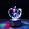 Apple-shaped custom crystal photo lamp on satin fabric with red roses and romantic card, personalized couple gift.