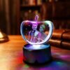 Clear apple photo crystal on a silver LED base with engraved couple portrait, personalized photo gift for couples.