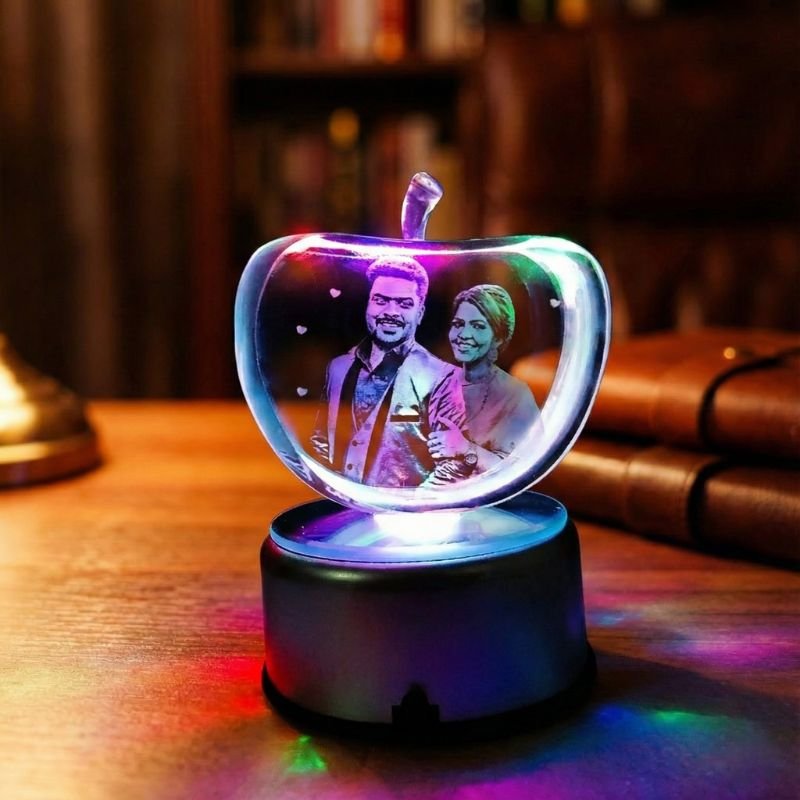 Clear apple photo crystal on a silver LED base with engraved couple portrait, personalized photo gift for couples.