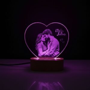 Heart-shaped personalized LED photo lamp with couple engraving, placed against warm bokeh lights for a romantic effect