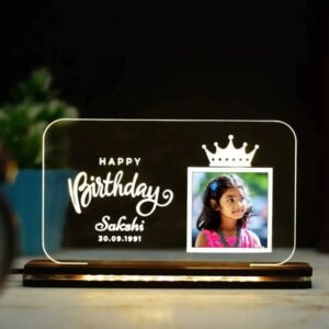 Personalized LED acrylic lamp with kid's picture and "Happy Birthday" text.