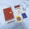 Personalized Raksha Bandhan Gift Hamper with Diary, Pen, Card Holder & Bracelet Rakhi - Customized items elegantly packed in a premium box.