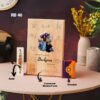 Personalized Wooden Sketch Frame Gift Set including an 8"x12" wooden sketch frame, Kit-Kat chocolate, Rakhi, and Roli Chawal, displayed on a table.