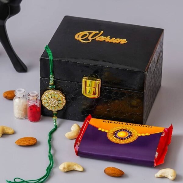 Personalized Rakhi Gift Set with a custom watch box, Rakhi, Roli Chawal, and Rakhi-themed chocolate.