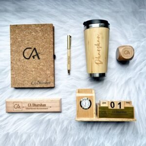 Personalized eco-friendly office gift set with cork diary, wooden travel mug, desktop name plate, wooden pen, pen stand, and paperweight.