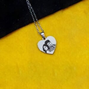 Custom heart-shaped stainless-steel photo pendant necklace engraved with couple image—personalised engraved jewellery gift for him & her in India.