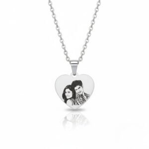 Personalized stainless steel heart pendant with engraved couple photo placed on white-blue background