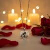 Romantic shot of personalized heart photo pendant placed on black box with rose petals and warm lights