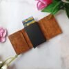 Personalized brown leather wallet with RFID card holder and multiple card slots, open view showing smooth tan finish and credit cards.