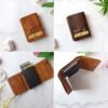 Set of customized leather wallets with nameplate ‘BALA’ and metal charms including heart, bike, and football — ideal personalized gift for men.