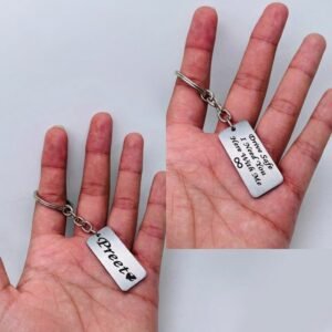 Personalised White Steel Photo Keychain – Engraved Name — lifestyle photo in real gifting setting