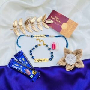 Personalised Bhaiya Bhabhi Evil Eye Rakhi Set with Names, Chocolates & Roli-Chawal — lifestyle photo in real gifting setting