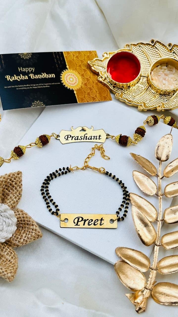 Personalised Bhaiya Bhabhi Set – Rudraksha Chain Name Rakhi + Bhabhi Mangalsutra Bracelet with Gold Roli-Chawal Thali - Image 3