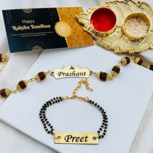Personalised bhaiya bhabhi set with rudraksha chain name rakhi, black-bead mangalsutra name bracelet, gold roli-chawal thali and Happy Raksha Bandhan greeting card
