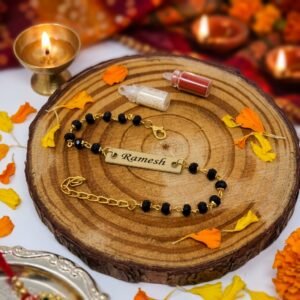 Personalised Black-Bead Gold-Chain Name Bracelet Rakhi — close-up detail view showing personalisation and craftsmanship