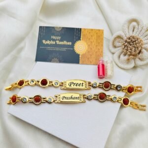 Personalised rudraksha and crystal stone name bracelet rakhi with engraved name plate, roli-chawal vials and Happy Raksha Bandhan greeting card