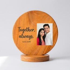 Personalised photo frame with quote printed on round mango wood, standing on wooden base