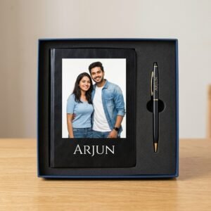 Personalised photo diary and pen gift set presented in its gift box on a desk