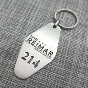 Stainless steel hotel-style key tag keychain engraved with hotel logo and room number 214